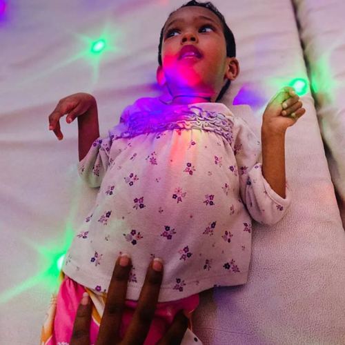 A girl enjoying the sensory lights