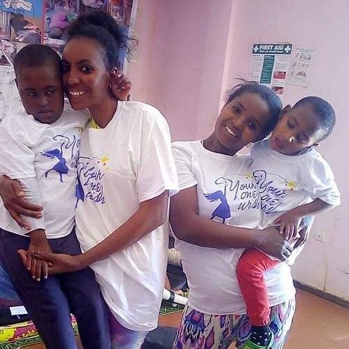 Nurses holding two of the children